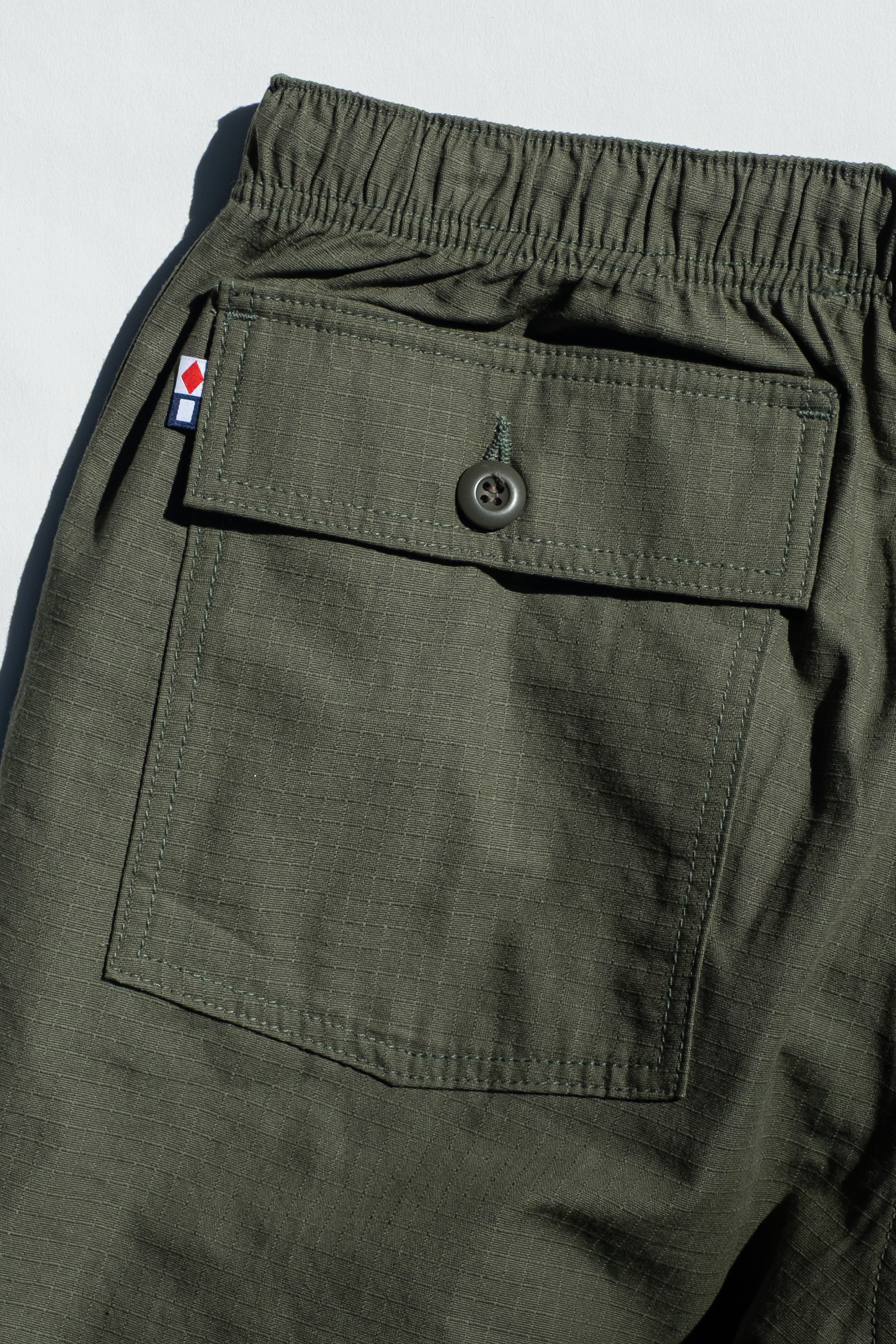 Favorite Pastime Cruiser Pant Army Green – rear flap pocket and Foxtrot Papa flag detail